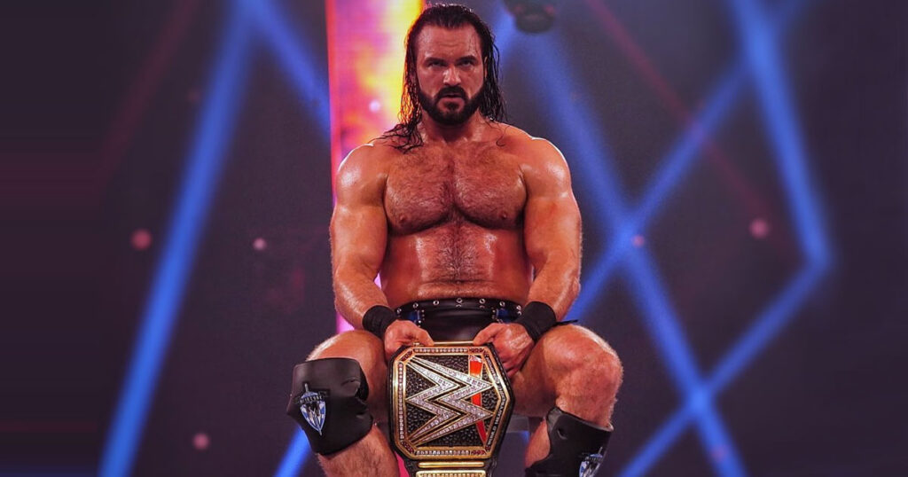 Drew McIntyre sitting on the ring with the WWE Championship