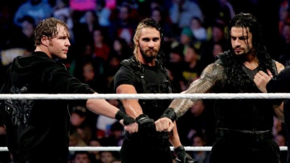 Roman Reigns, Seth Rollins and Dean Ambrose posing in a wwe ring