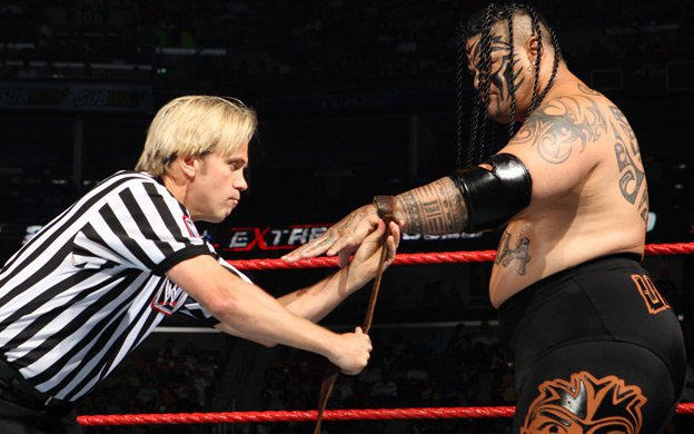 Umaga with referee Charles Robinson before his last match in WWE, against CM Punk