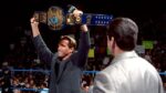 Arnold schwarzenegger in the WWE with Vince McMahon. holding the WWE Championship above his head