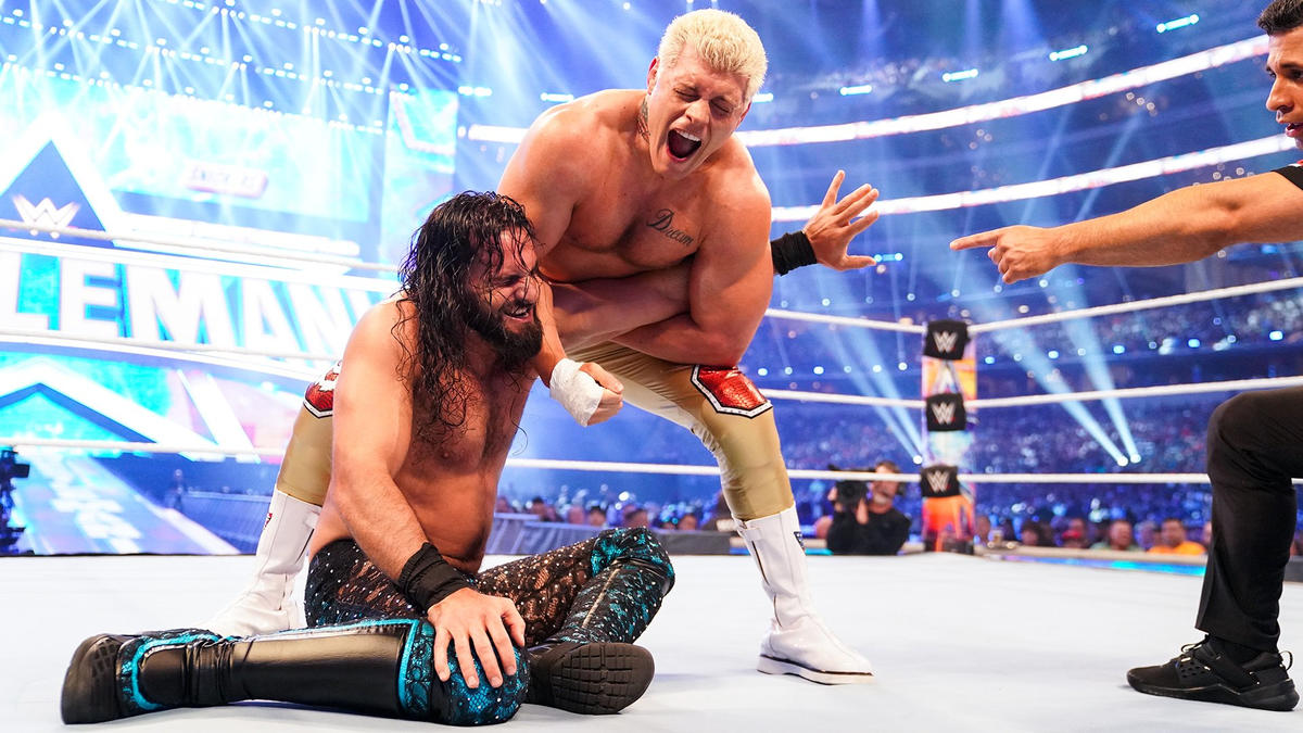 Cody Rhodes trapping Seth Rollins in an arm submission at WrestleMania 38