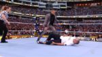 Shane McMahon lies on the mat after suffering a knee injury against The Miz at WrestleMania 39